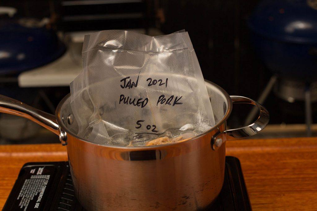 Place a bag of vacuum sealed pork into boiling wate